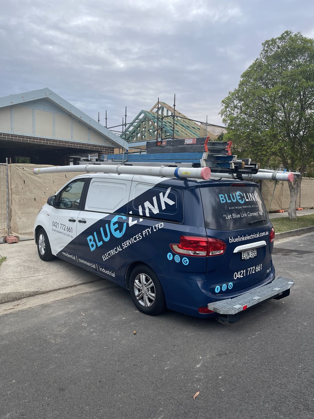 Blue Link Electrical Services van with ladders and conduit